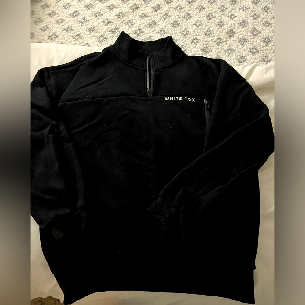 White Fox size S/M black oversized 1/4 zip front. Used rarely worn - good cond